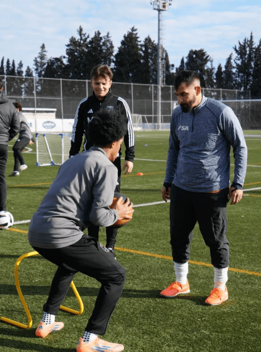 FSA coach running a one-on-one performance drill with a player